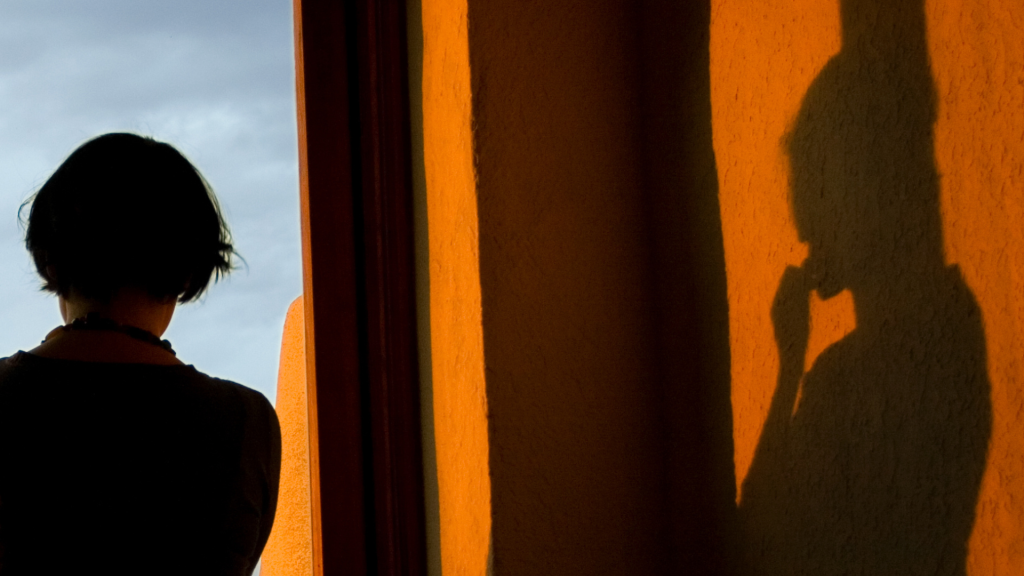 woman standing in front of a window