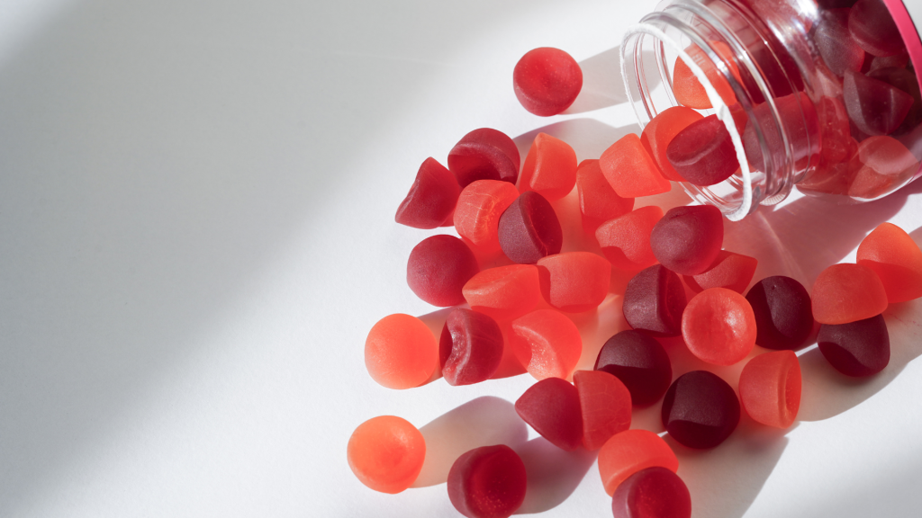 shroom gummies in a bottle spilled on a table