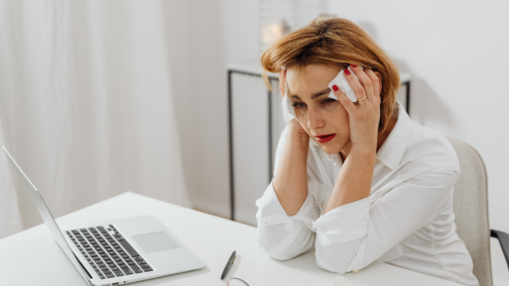 woman holding her head